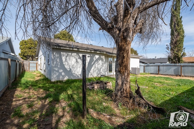 exterior space with a fenced backyard