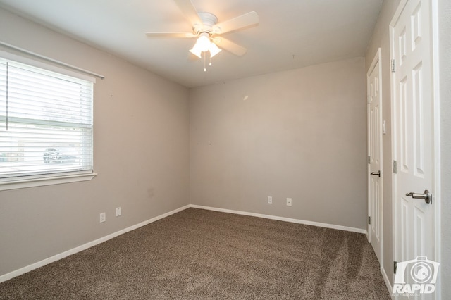 unfurnished bedroom with baseboards, carpet floors, and a ceiling fan