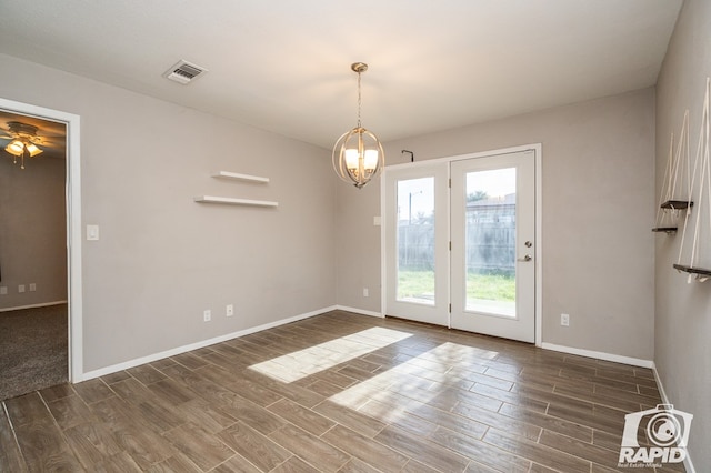 interior space featuring baseboards, visible vents, and wood tiled floor