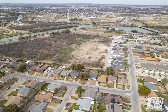 birds eye view of property with a residential view and a water view