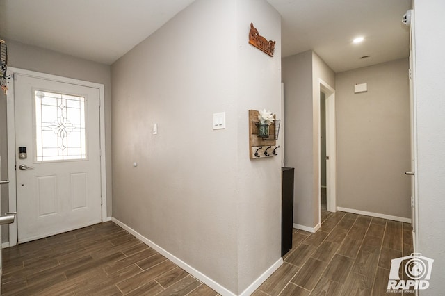 entryway featuring wood finish floors and baseboards