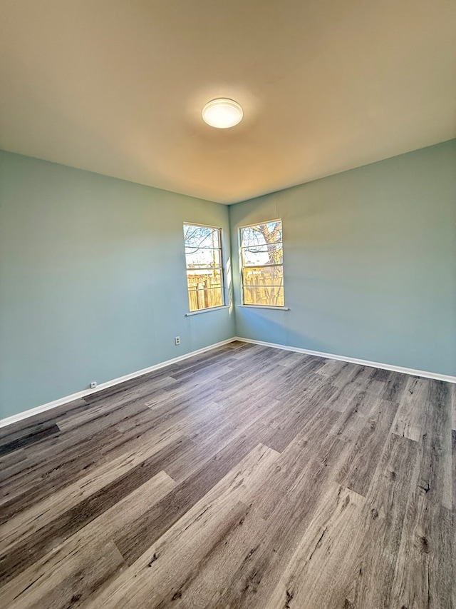 unfurnished room featuring wood-type flooring