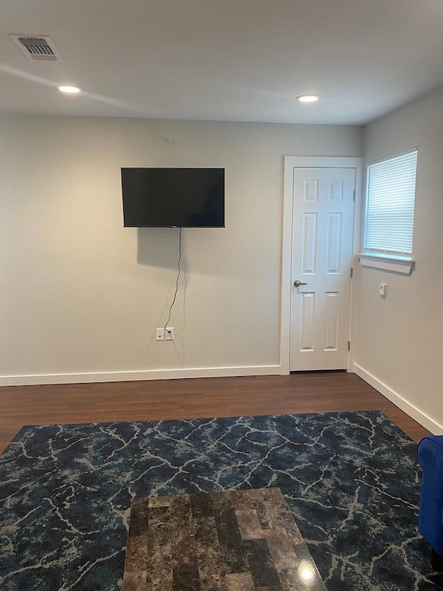 interior space with dark hardwood / wood-style flooring