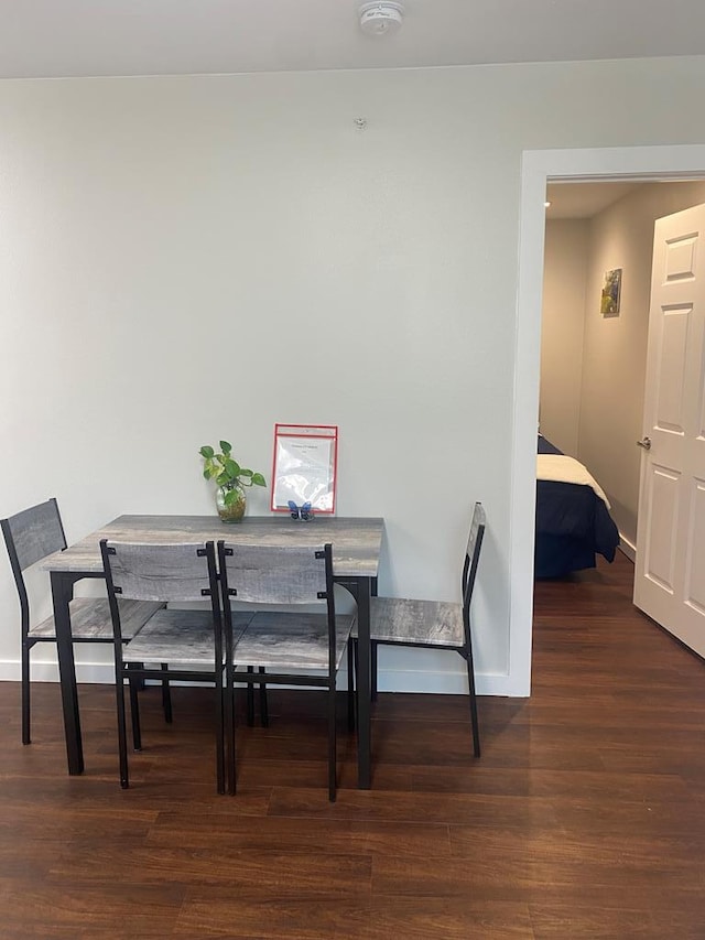 dining area featuring dark hardwood / wood-style flooring