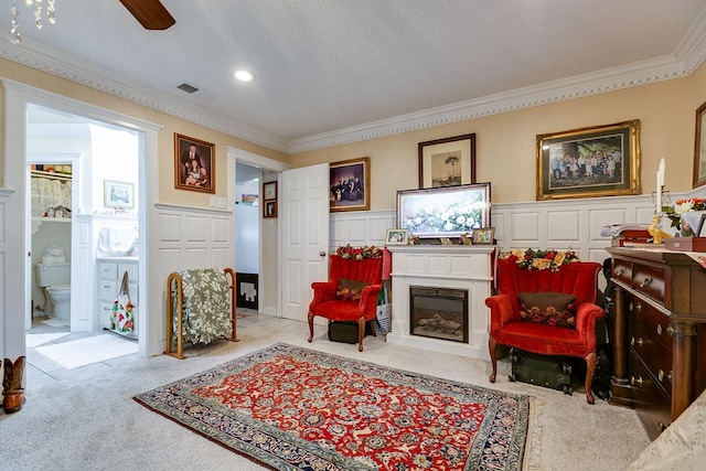 3626 Willowbrook Dr, San Angelo, TX 76904 - living area featuring ornamental molding, carpet, a decorative wall, and visible vents