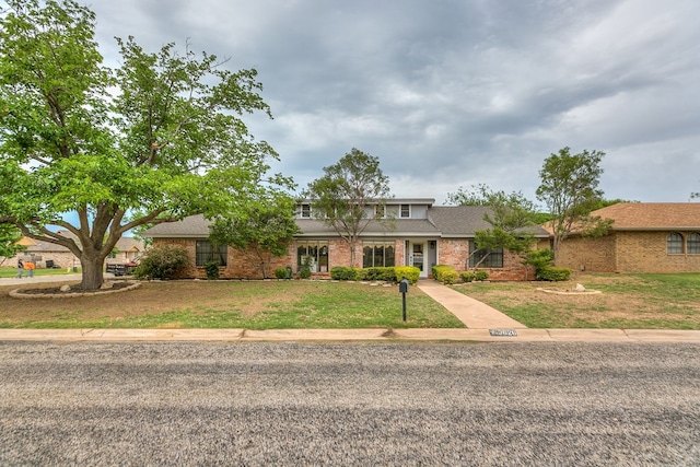 3626 Willowbrook Dr, San Angelo, TX 76904 - view of front of house featuring brick siding and a front lawn