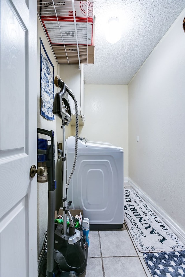 3626 Willowbrook Dr, San Angelo, TX 76904 - interior space featuring laundry area, a textured ceiling, baseboards, and tile patterned floors