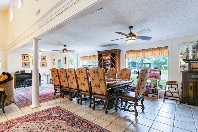 3626 Willowbrook Dr, San Angelo, TX 76904 - dining room with light tile patterned floors, a ceiling fan, visible vents, and decorative columns