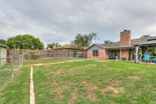 3626 Willowbrook Dr, San Angelo, TX 76904 - view of yard featuring a fenced backyard, a gazebo, and a patio area
