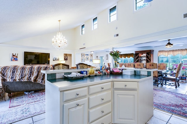 3626 Willowbrook Dr, San Angelo, TX 76904 - kitchen featuring light tile patterned floors, high vaulted ceiling, open floor plan, white cabinetry, and visible vents