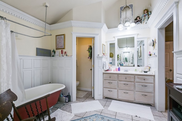 3626 Willowbrook Dr, San Angelo, TX 76904 - full bathroom with a soaking tub, an inviting chandelier, toilet, and vanity