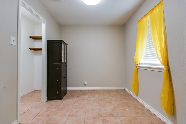 3634 Old Post Cir, San Angelo, TX 76904 - unfurnished room with light tile patterned flooring and baseboards