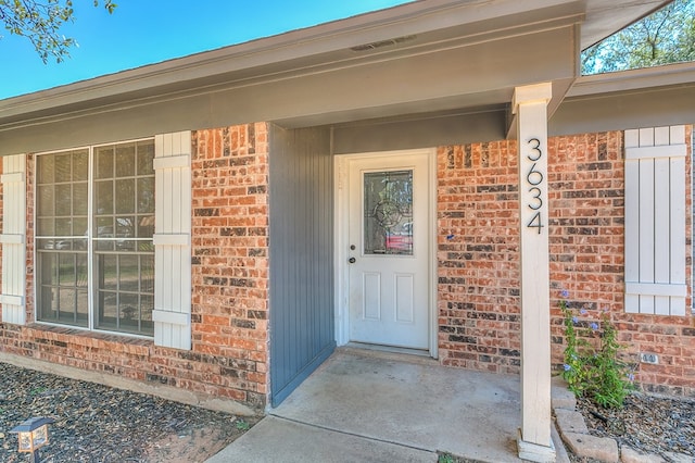 3634 Old Post Cir, San Angelo, TX 76904 - doorway to property featuring brick siding