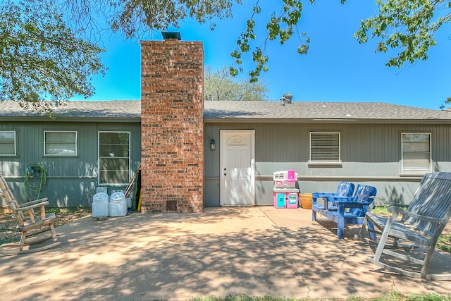 3634 Old Post Cir, San Angelo, TX 76904 - back of house with a patio and roof with shingles
