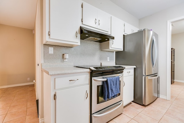 3634 Old Post Cir, San Angelo, TX 76904 - kitchen featuring stainless steel appliances, under cabinet range hood, light tile patterned flooring, and light countertops