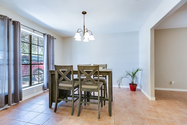 3634 Old Post Cir, San Angelo, TX 76904 - dining room featuring light tile patterned floors, a chandelier, and baseboards