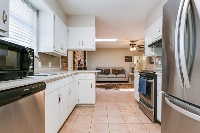 3634 Old Post Cir, San Angelo, TX 76904 - kitchen with appliances with stainless steel finishes, ceiling fan, open floor plan, light tile patterned flooring, and tasteful backsplash