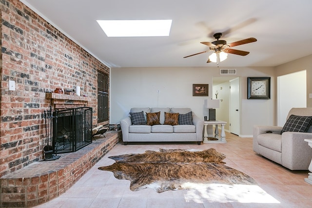 3634 Old Post Cir, San Angelo, TX 76904 - tiled living area with a skylight, a ceiling fan, brick wall, and a fireplace