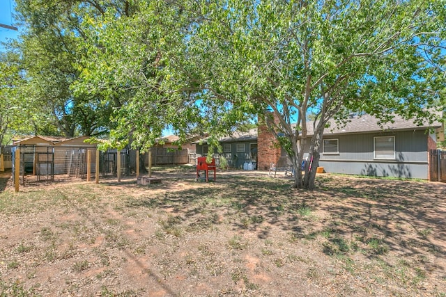 3634 Old Post Cir, San Angelo, TX 76904 - fenced backyard featuring an outdoor structure and exterior structure