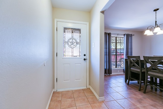 3634 Old Post Cir, San Angelo, TX 76904 - foyer featuring a chandelier, light tile patterned floors, and baseboards