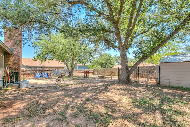 3634 Old Post Cir, San Angelo, TX 76904 - fenced backyard with a patio