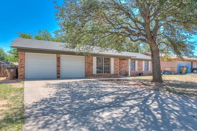 3634 Old Post Cir, San Angelo, TX 76904 - ranch-style home with an attached garage, concrete driveway, and brick siding