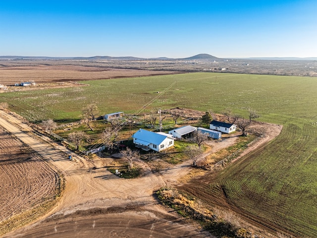 birds eye view of property featuring a mountain view and a rural view