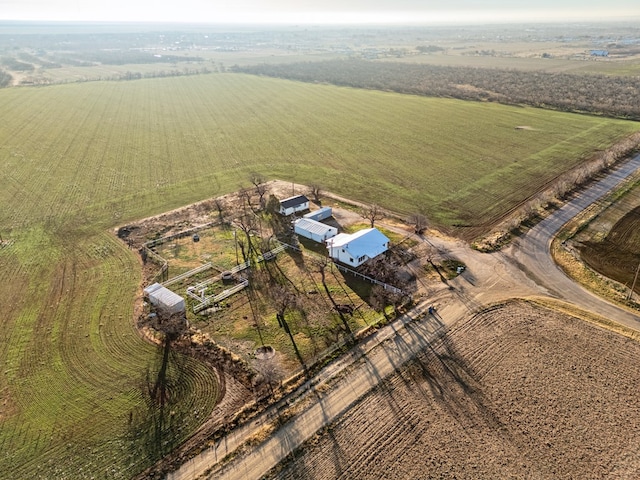 birds eye view of property with a rural view