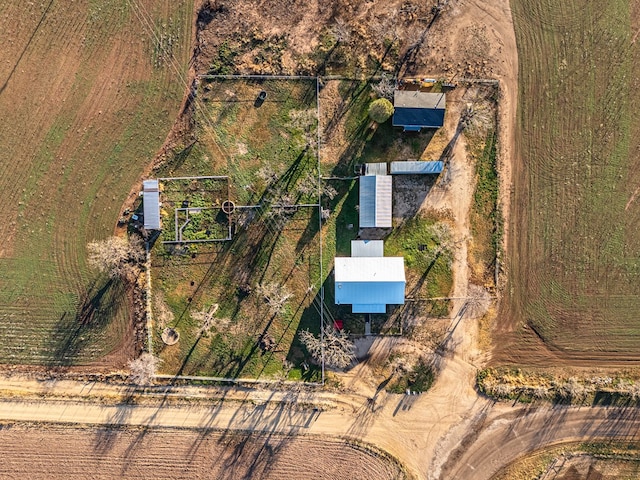 birds eye view of property with a rural view