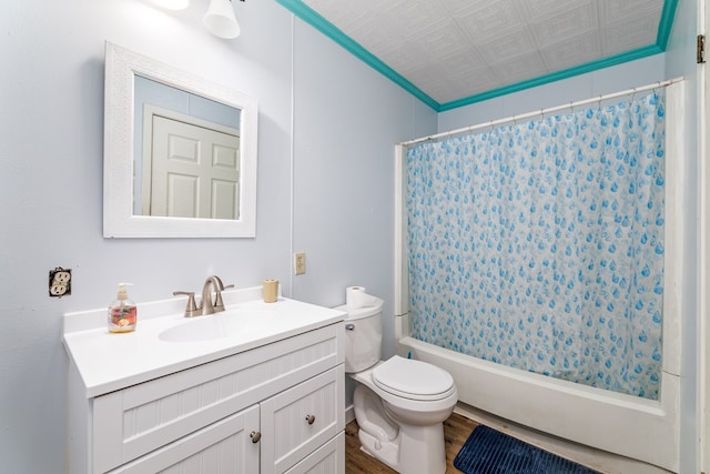 full bathroom featuring vanity, toilet, hardwood / wood-style floors, and shower / bath combo with shower curtain