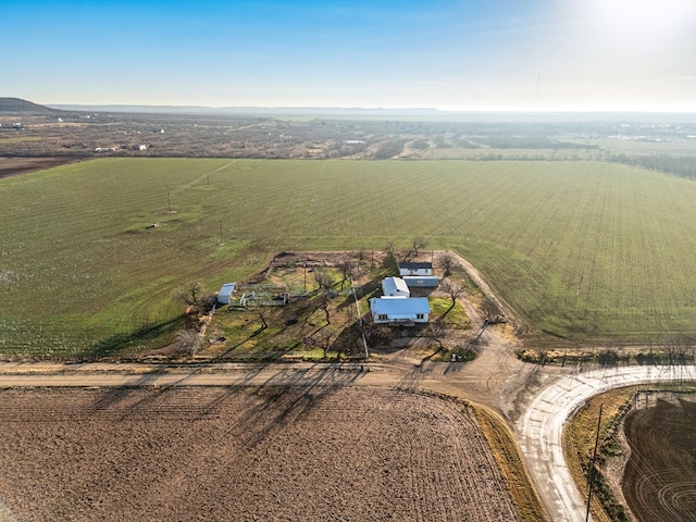 birds eye view of property with a rural view