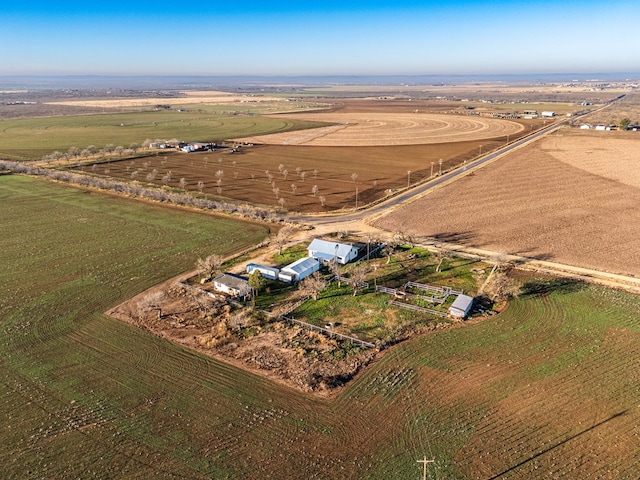 birds eye view of property with a rural view