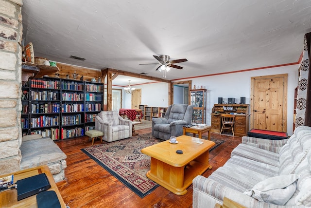 living room with hardwood / wood-style floors, crown molding, and ceiling fan with notable chandelier