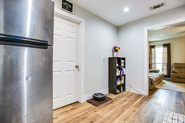 213 Paint Rock Rd, San Angelo, TX 76903 - entryway with light wood-style floors, baseboards, and recessed lighting