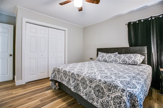 213 Paint Rock Rd, San Angelo, TX 76903 - bedroom with ornamental molding, wood finished floors, a closet, and a ceiling fan