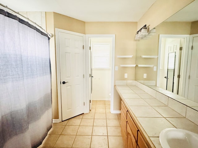 bathroom with tile patterned flooring, vanity, walk in shower, and toilet