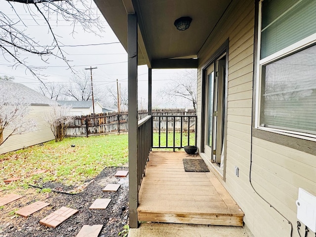 wooden deck with a yard