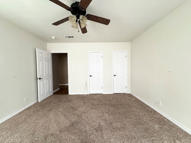 unfurnished bedroom featuring ceiling fan and carpet flooring