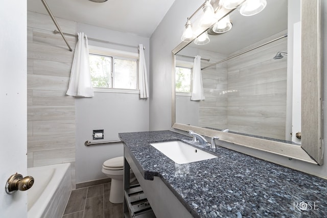3109 College Hills Cir, San Angelo, TX 76904 - bathroom featuring vanity, wood finish floors, and shower / bathtub combination