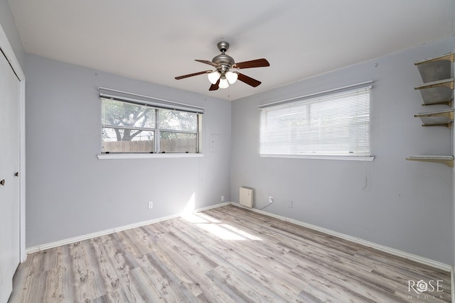 3109 College Hills Cir, San Angelo, TX 76904 - unfurnished bedroom with wood finished floors, a closet, and a ceiling fan