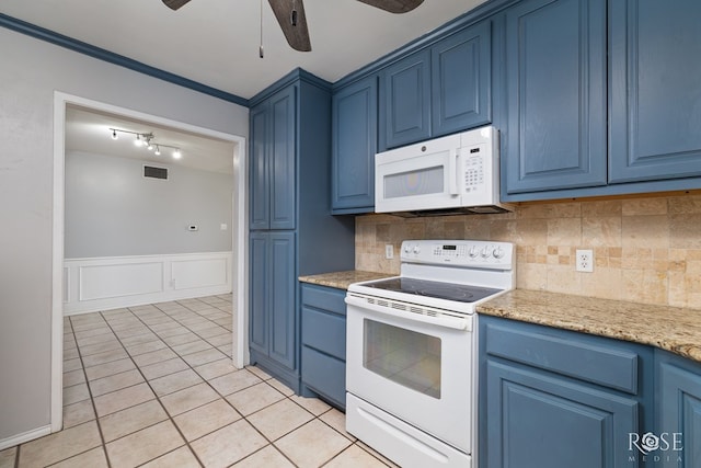 3109 College Hills Cir, San Angelo, TX 76904 - kitchen with white appliances, blue cabinetry, a ceiling fan, wainscoting, and a decorative wall