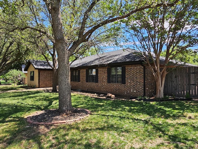 view of property exterior featuring a lawn