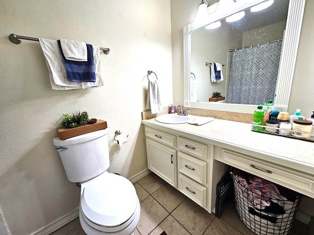 bathroom with tile patterned flooring, vanity, curtained shower, and toilet