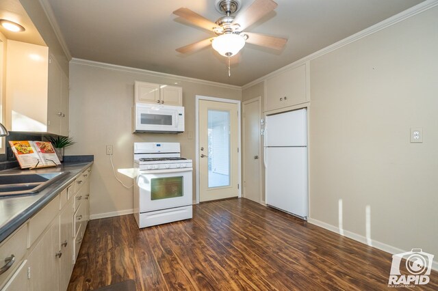 kitchen featuring dark hardwood / wood-style flooring, sink, white appliances, and crown molding