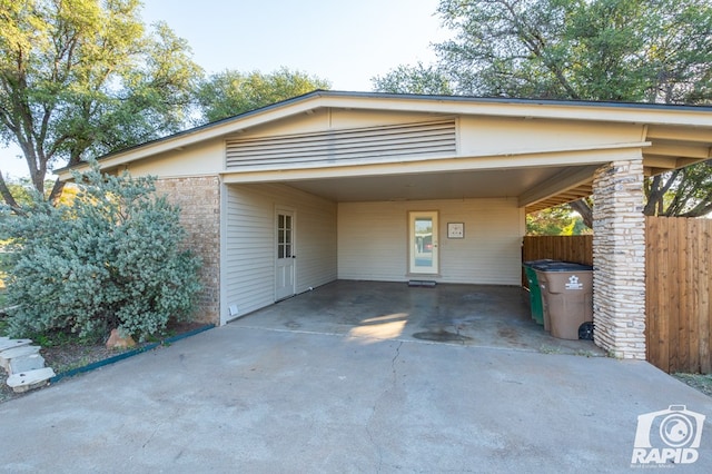 view of vehicle parking with a carport