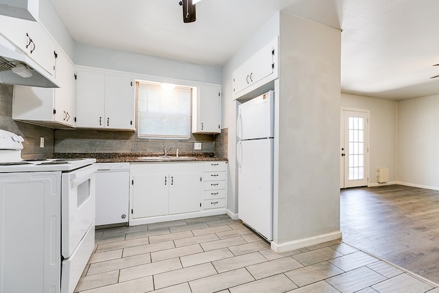 2021 Field Ave, San Angelo, TX 76901 - kitchen featuring white appliances, a sink, dark countertops, tasteful backsplash, and white cabinetry