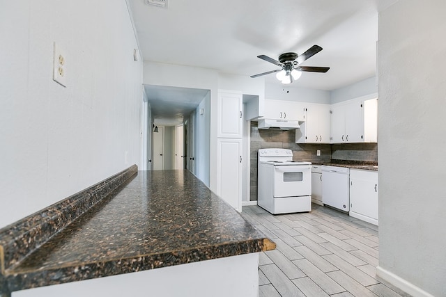 2021 Field Ave, San Angelo, TX 76901 - kitchen with white appliances, under cabinet range hood, a ceiling fan, white cabinets, and dark countertops