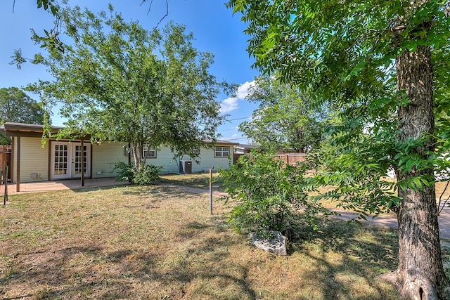 2021 Field Ave, San Angelo, TX 76901 - view of yard featuring french doors and a patio