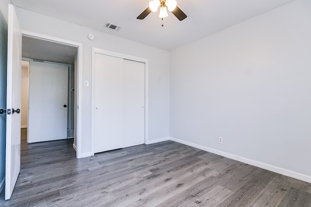 2021 Field Ave, San Angelo, TX 76901 - unfurnished bedroom featuring wood finished floors, baseboards, a closet, and ceiling fan