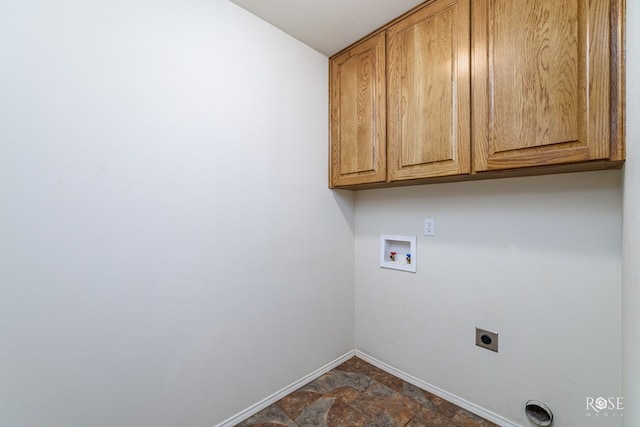 laundry area with electric dryer hookup, hookup for a washing machine, and cabinets